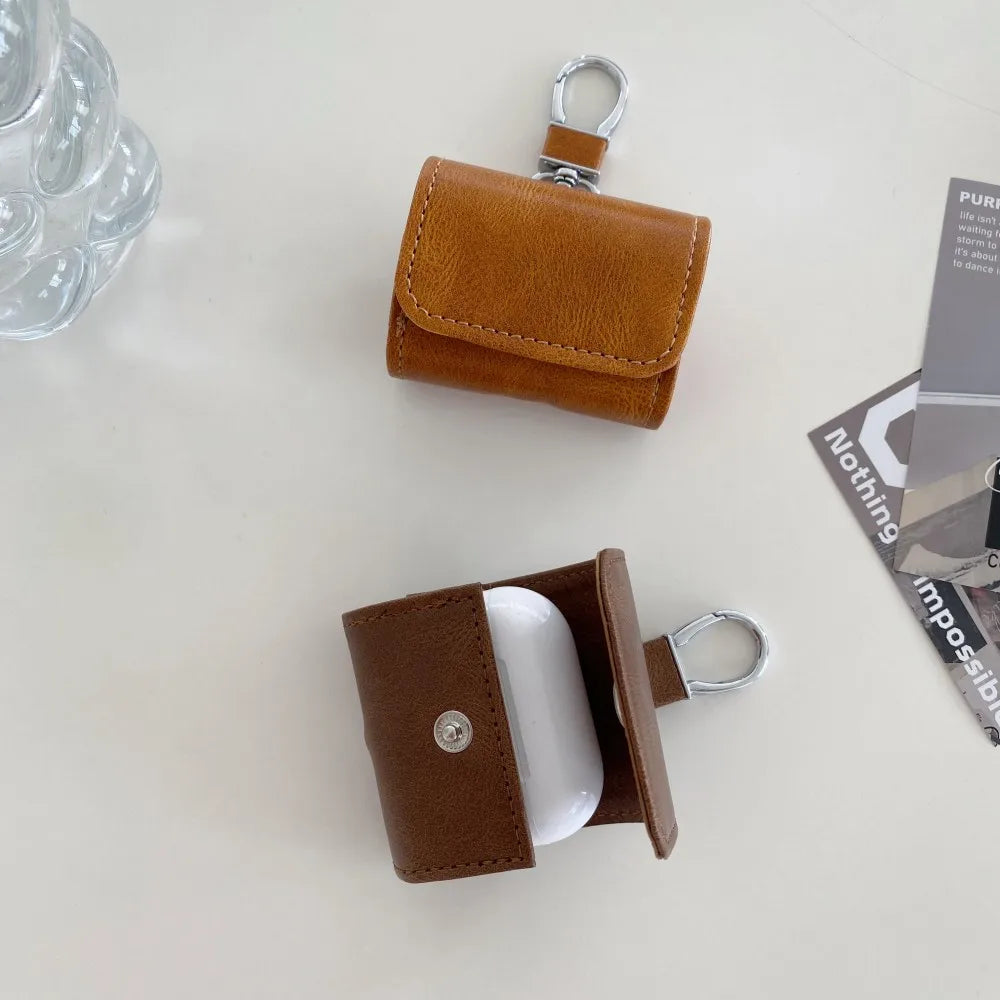 Leather Buckle Protective Case for AirPods Pro 2, AirPods Pro & AirPods 4 – Premium Cover with Keychain Hook & Dust-Proof Design